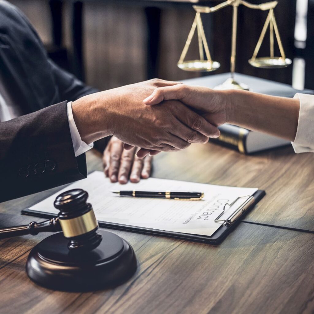 attorney shaking hands with client